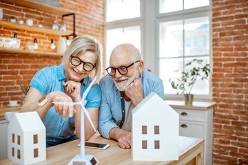 Image of two people looking at house structures